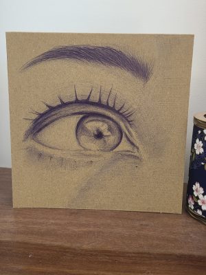 œil dessiné au stylo qui regarde sur le côté
